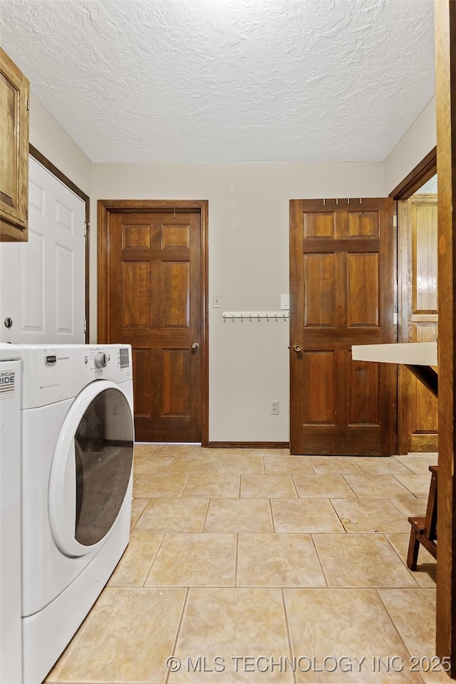 9644 Ew 19 Rd, Nowata, OK 74048 - laundry room featuring washer / clothes dryer, cabinet space, and a textured ceiling