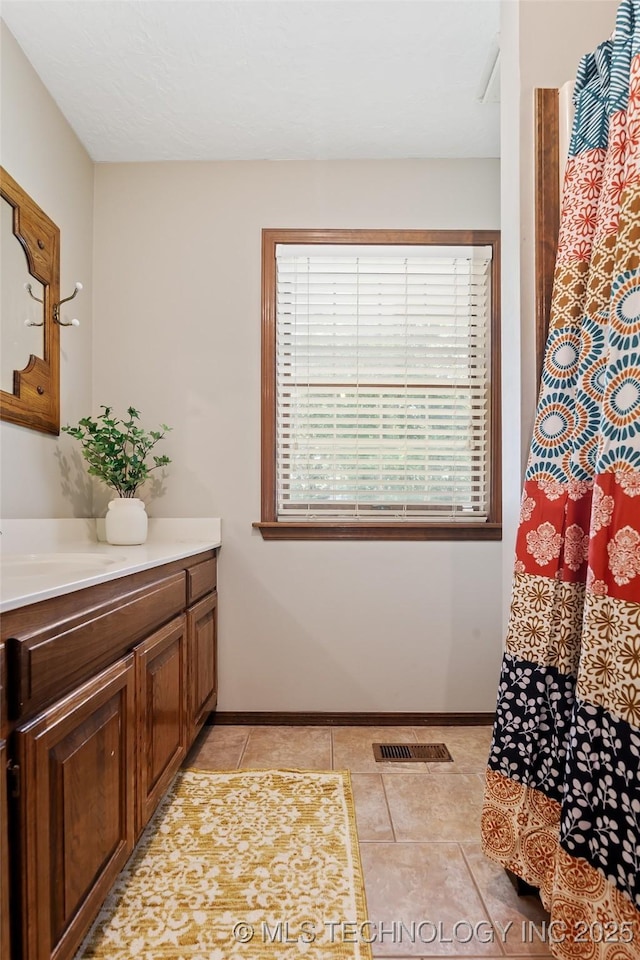 9644 Ew 19 Rd, Nowata, OK 74048 - bathroom featuring vanity and tile patterned flooring