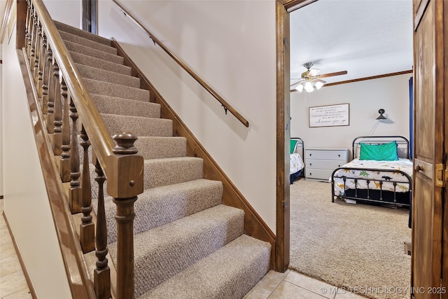 9644 Ew 19 Rd, Nowata, OK 74048 - stairway with carpet, ceiling fan, tile patterned floors, and crown molding