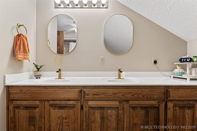 9644 Ew 19 Rd, Nowata, OK 74048 - full bath with double vanity, a textured ceiling, and vaulted ceiling