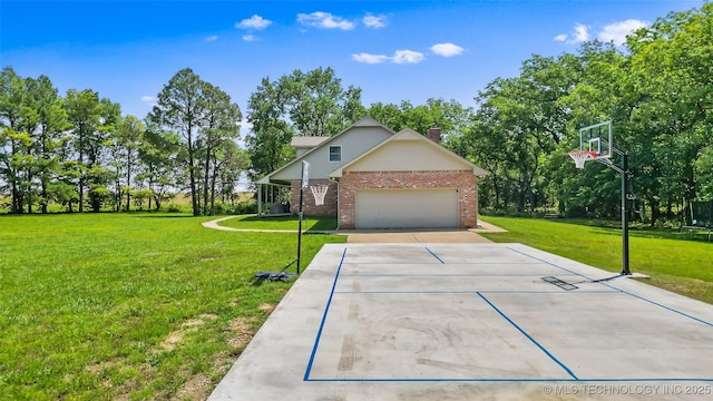 9644 Ew 19 Rd, Nowata, OK 74048 - view of home's exterior with brick siding, a lawn, concrete driveway, a chimney, and an attached garage