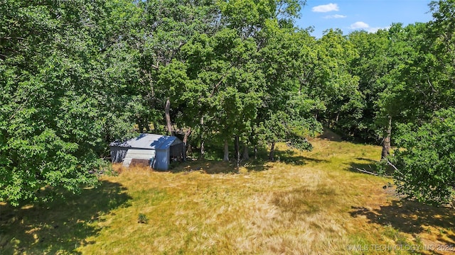 9644 Ew 19 Rd, Nowata, OK 74048 - view of yard featuring a storage shed