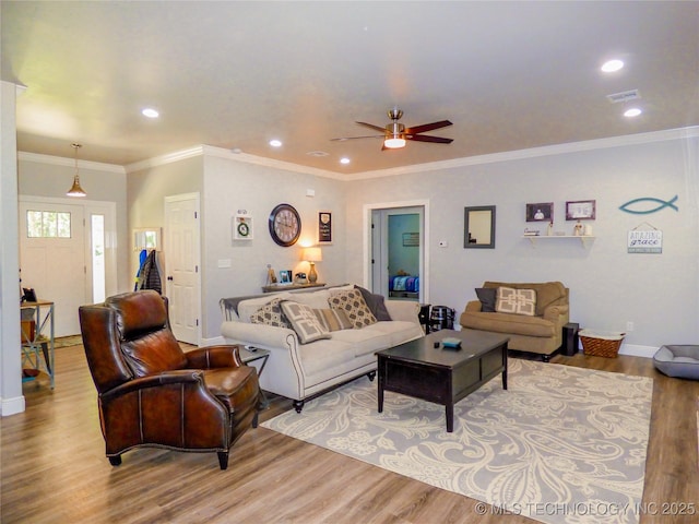 414467 E 1090th Rd, Checotah, OK 74426 - living room with wood finished floors, ceiling fan, recessed lighting, and crown molding