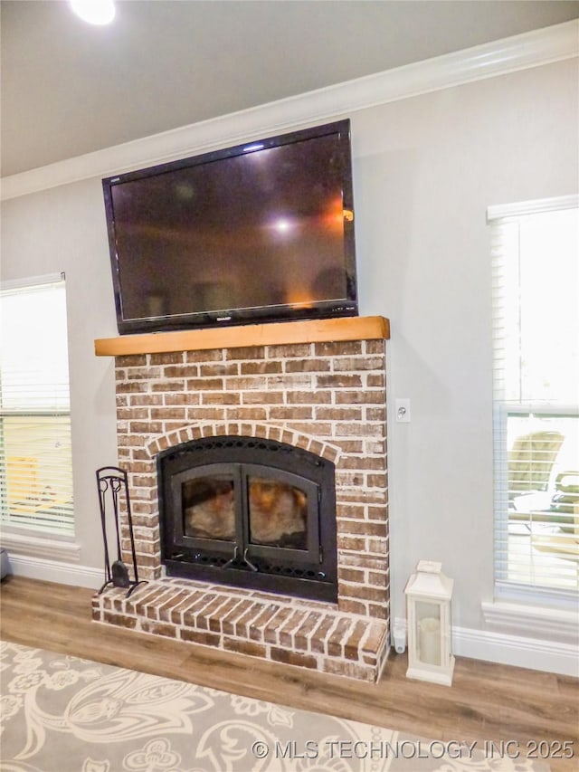 414467 E 1090th Rd, Checotah, OK 74426 - detailed view of wood finished floors, a brick fireplace, and ornamental molding
