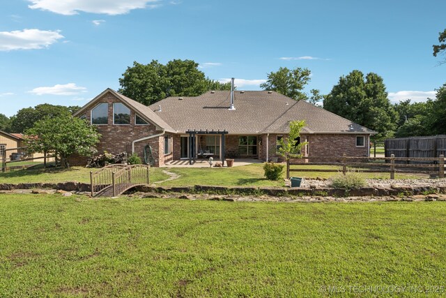 12920 E 183rd St S, Bixby, OK 74008 - back of property featuring brick siding, a patio, and a shingled roof
