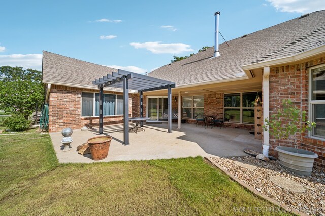 12920 E 183rd St S, Bixby, OK 74008 - rear view of property featuring brick siding, roof with shingles, a pergola, and a yard