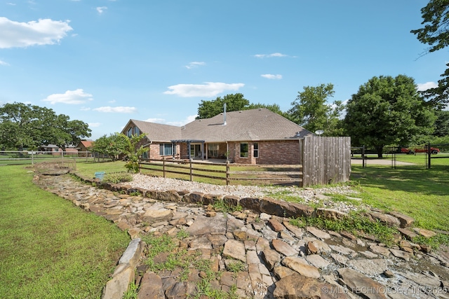 12920 E 183rd St S, Bixby, OK 74008 - rear view of house featuring brick siding, a fenced backyard, and roof with shingles