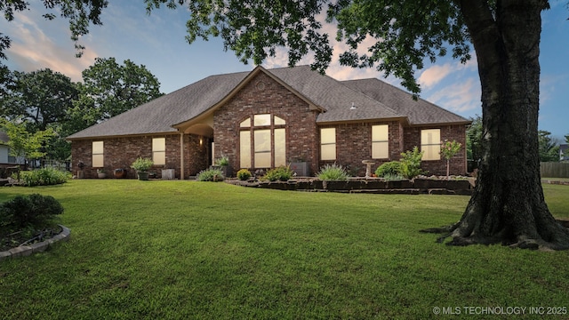 12920 E 183rd St S, Bixby, OK 74008 - view of front of home featuring brick siding, a lawn, and a shingled roof