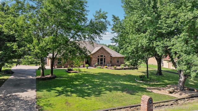12920 E 183rd St S, Bixby, OK 74008 - view of front of house with a front yard and brick siding