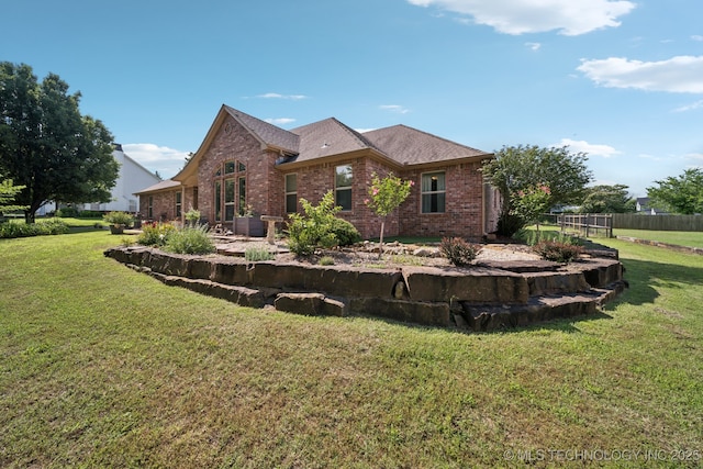 12920 E 183rd St S, Bixby, OK 74008 - back of house featuring brick siding and roof with shingles