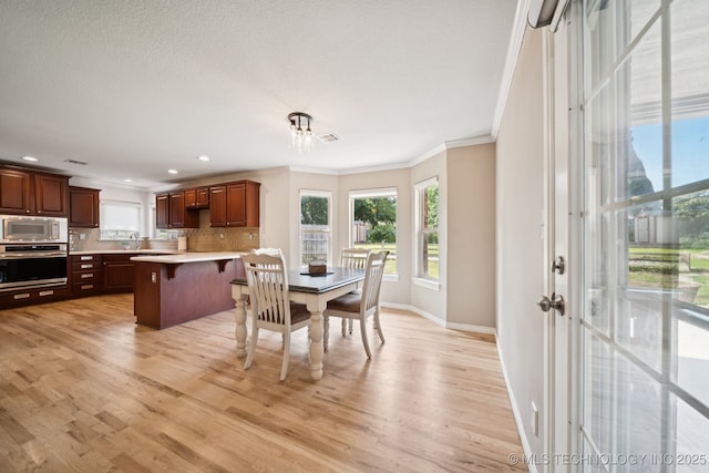 12920 E 183rd St S, Bixby, OK 74008 - dining room featuring crown molding, light wood-style flooring, and recessed lighting