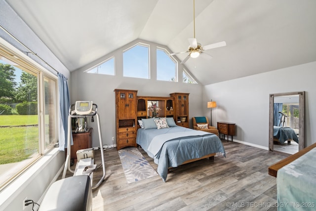 12920 E 183rd St S, Bixby, OK 74008 - bedroom with vaulted ceiling, wood finished floors, multiple windows, and ceiling fan