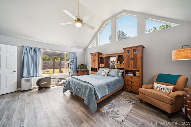 12920 E 183rd St S, Bixby, OK 74008 - bedroom with high vaulted ceiling, wood finished floors, and a ceiling fan
