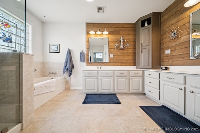 12920 E 183rd St S, Bixby, OK 74008 - full bathroom with wood walls, vanity, tile patterned floors, a garden tub, and a tile shower