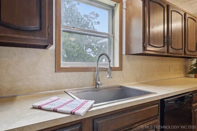 18005 S 4185th Rd, Claremore, OK 74017 - kitchen with black dishwasher, light countertops, and dark brown cabinets