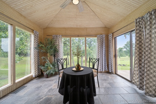 18005 S 4185th Rd, Claremore, OK 74017 - sunroom featuring lofted ceiling, stone tile floors, wooden ceiling, and wooden walls