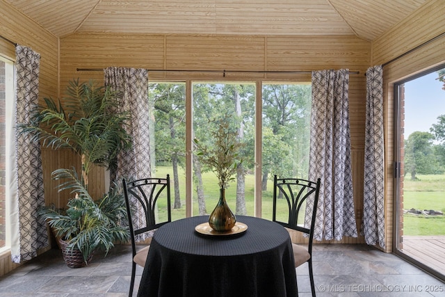 18005 S 4185th Rd, Claremore, OK 74017 - sunroom featuring vaulted ceiling, stone tile flooring, wood ceiling, and wood walls