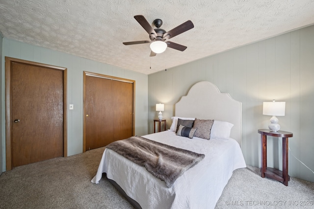 18005 S 4185th Rd, Claremore, OK 74017 - carpeted bedroom with a closet, a textured ceiling, and a ceiling fan