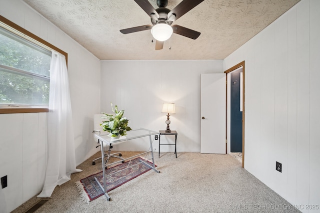18005 S 4185th Rd, Claremore, OK 74017 - office area featuring a ceiling fan, carpet flooring, a textured ceiling, and wood walls