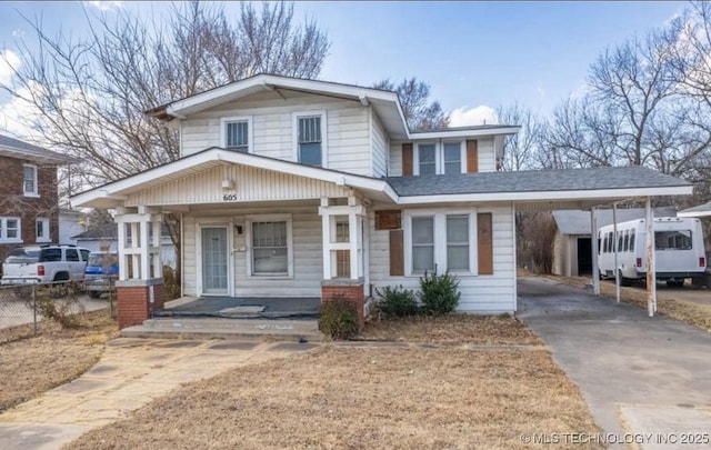 605 N Washington, Ardmore, OK 73401 - view of front of house with covered porch, asphalt driveway, and an attached carport