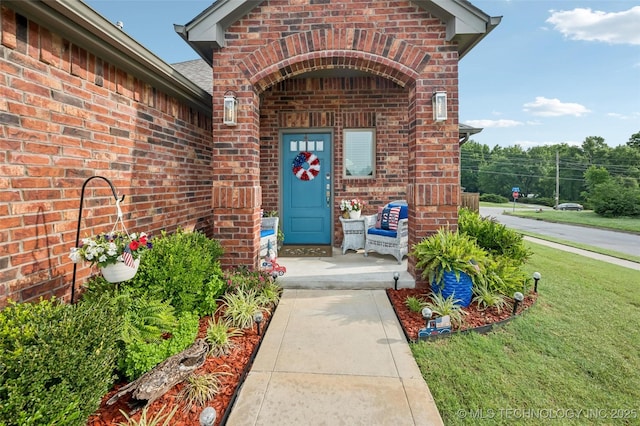 2402 W Kingsport Ct S, Broken Arrow, OK 74011 - doorway to property featuring brick siding and a yard