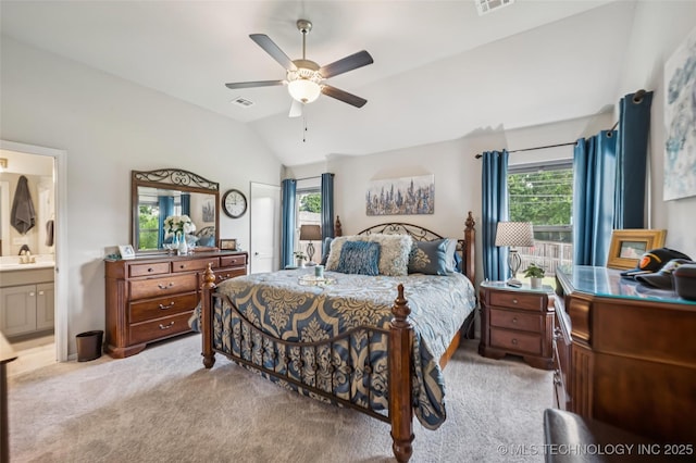 2402 W Kingsport Ct S, Broken Arrow, OK 74011 - bedroom featuring vaulted ceiling, light colored carpet, connected bathroom, and ceiling fan