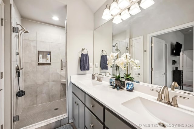2402 W Kingsport Ct S, Broken Arrow, OK 74011 - full bathroom featuring a stall shower, double vanity, and recessed lighting