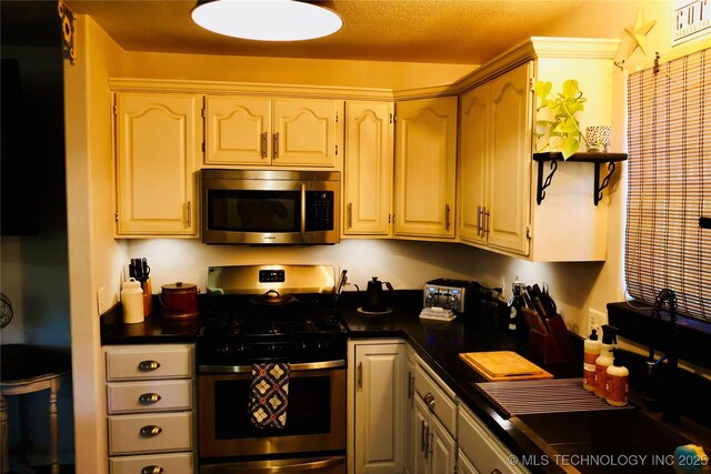 330 Kiamichi, Eufaula, OK 74432 - kitchen featuring stainless steel appliances, dark countertops, and open shelves