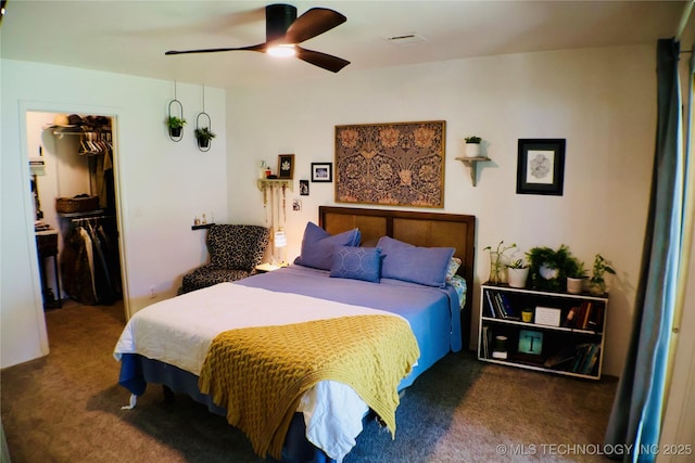330 Kiamichi, Eufaula, OK 74432 - bedroom with carpet floors, a walk in closet, a closet, and a ceiling fan