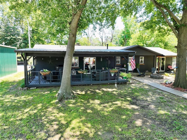 330 Kiamichi, Eufaula, OK 74432 - view of front facade with a fire pit and a front lawn