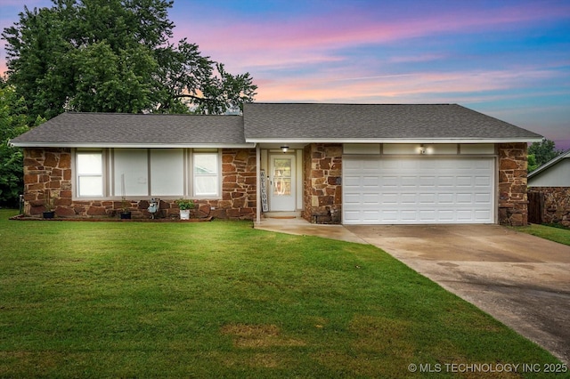 30078 E 143rd St S, Coweta, OK 74429 - view of front of house with stone siding, driveway, a lawn, and an attached garage