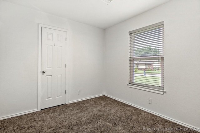 30078 E 143rd St S, Coweta, OK 74429 - spare room with dark carpet and baseboards
