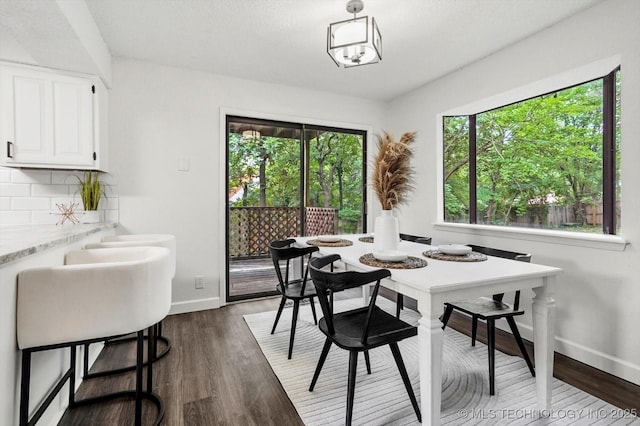 2012 N Santa Fe Ave, Tulsa, OK 74127 - dining room with baseboards and dark wood-style floors
