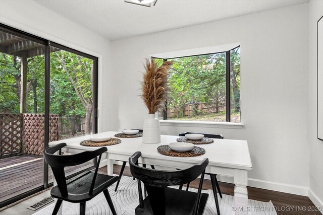 2012 N Santa Fe Ave, Tulsa, OK 74127 - dining space with breakfast area, plenty of natural light, and wood finished floors