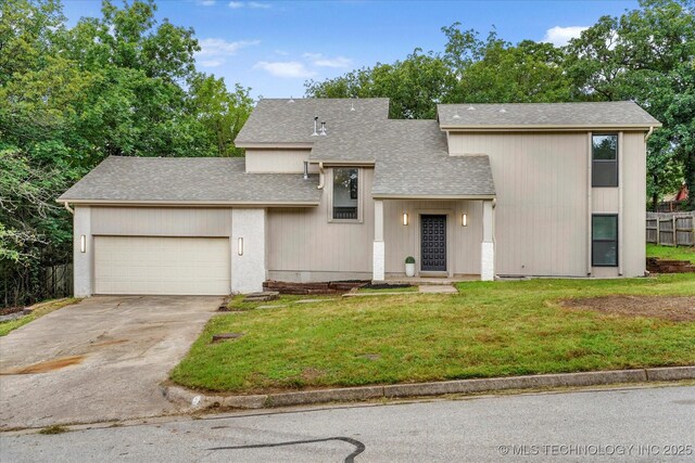 2012 N Santa Fe Ave, Tulsa, OK 74127 - view of front of home featuring roof with shingles, an attached garage, and driveway