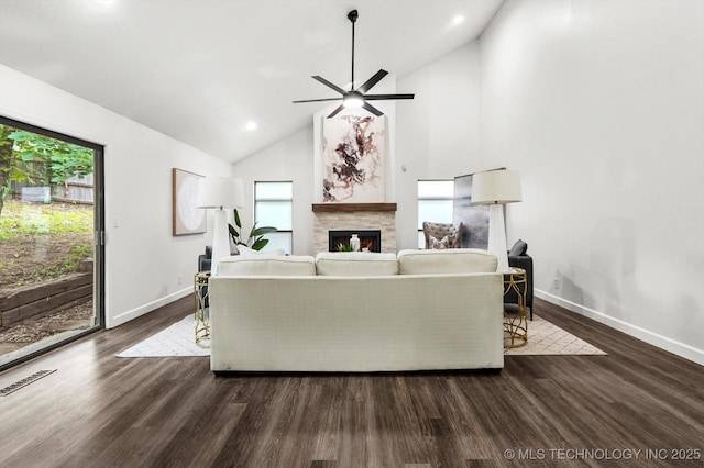 2012 N Santa Fe Ave, Tulsa, OK 74127 - living room with a warm lit fireplace, dark wood-type flooring, a ceiling fan, high vaulted ceiling, and recessed lighting