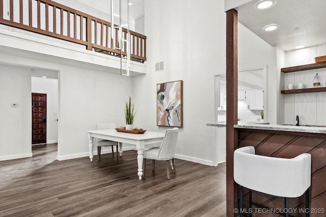 2012 N Santa Fe Ave, Tulsa, OK 74127 - dining space with a high ceiling, wood finished floors, and recessed lighting