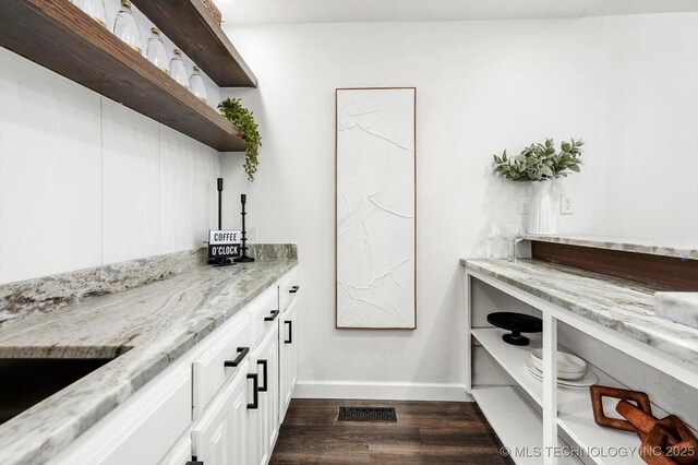 2012 N Santa Fe Ave, Tulsa, OK 74127 - bar featuring baseboards and dark wood-type flooring