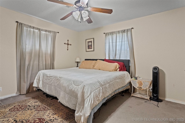 367 Elm, Lone Grove, OK 73443 - carpeted bedroom featuring baseboards and a ceiling fan
