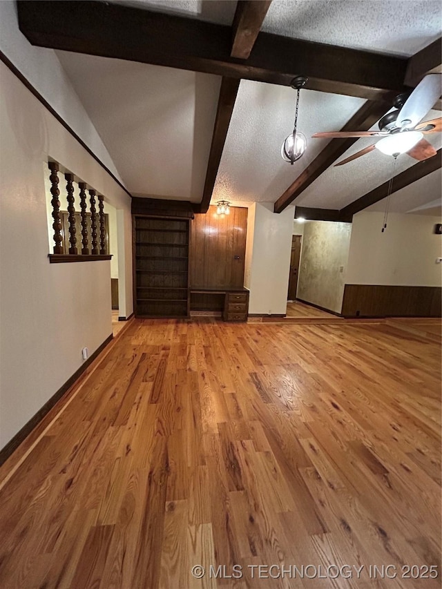 23536 Timber Trl W, Bristow, OK 74010 - unfurnished living room with light wood-style flooring, a textured ceiling, and a ceiling fan
