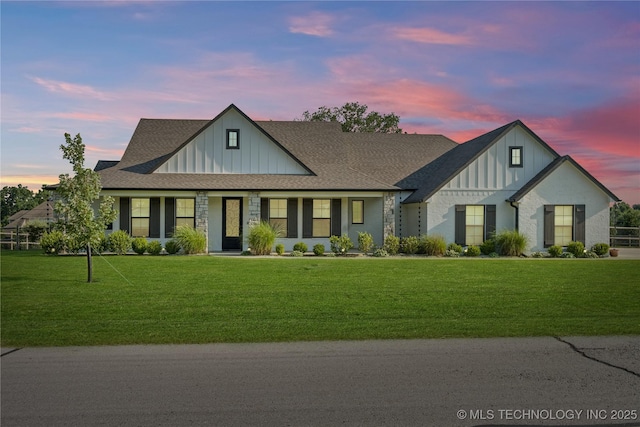 6904 E 86th Pl N, Owasso, OK 74055 - view of front facade featuring board and batten siding, a lawn, and roof with shingles