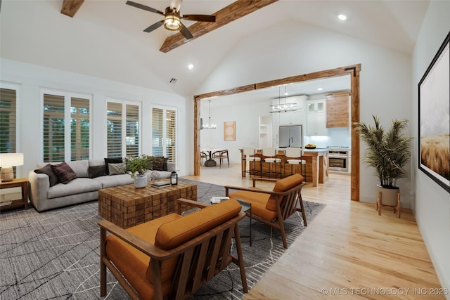6904 E 86th Pl N, Owasso, OK 74055 - living room featuring a chandelier, a ceiling fan, light wood-style flooring, high vaulted ceiling, and recessed lighting