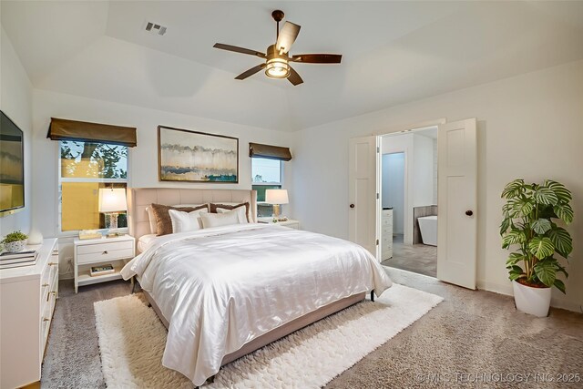 6904 E 86th Pl N, Owasso, OK 74055 - bedroom featuring carpet floors, ensuite bath, and ceiling fan