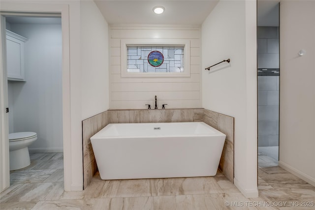 6904 E 86th Pl N, Owasso, OK 74055 - bathroom featuring a freestanding tub and marble look tile flooring