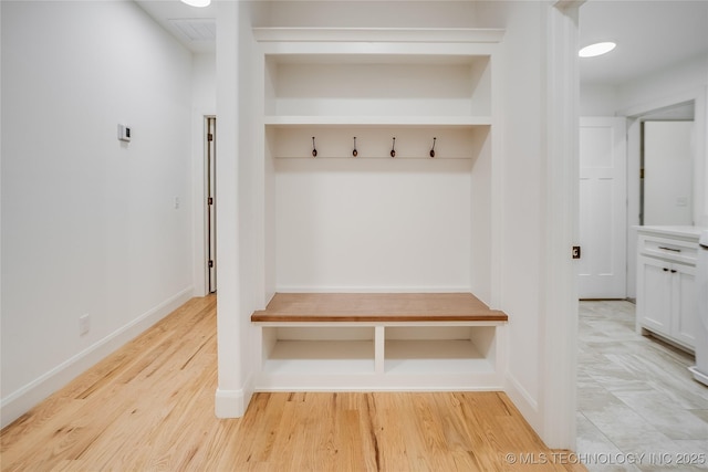 6904 E 86th Pl N, Owasso, OK 74055 - mudroom featuring light wood-style flooring and baseboards