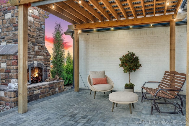 6904 E 86th Pl N, Owasso, OK 74055 - view of patio with an outdoor stone fireplace