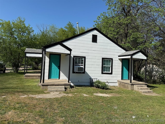 2705 E Ute St, Tulsa, OK 74110 - rear view of house featuring a lawn and cooling unit