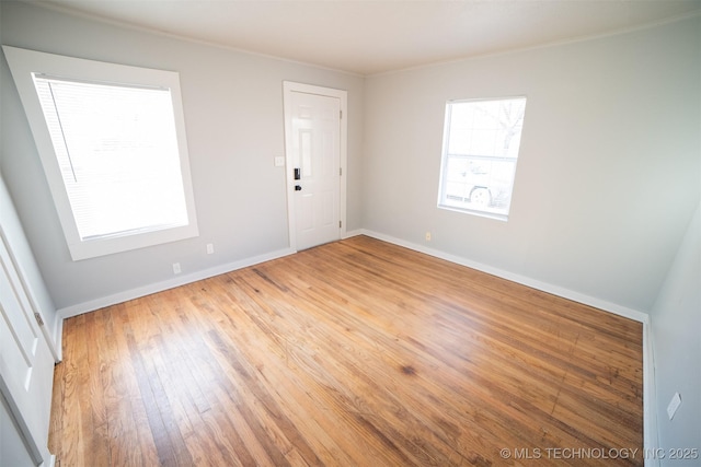 2705 E Ute St, Tulsa, OK 74110 - unfurnished room featuring light wood-type flooring and crown molding