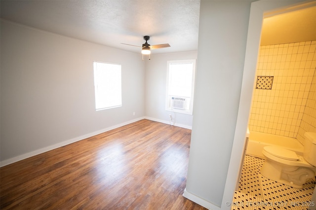2705 E Ute St, Tulsa, OK 74110 - empty room featuring ceiling fan, wood finished floors, and cooling unit