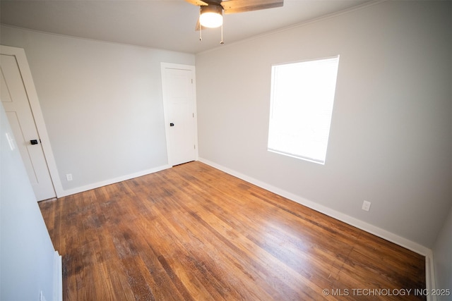 2705 E Ute St, Tulsa, OK 74110 - empty room with a ceiling fan, wood finished floors, and crown molding
